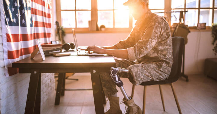 Disabled veteran working on his laptop
